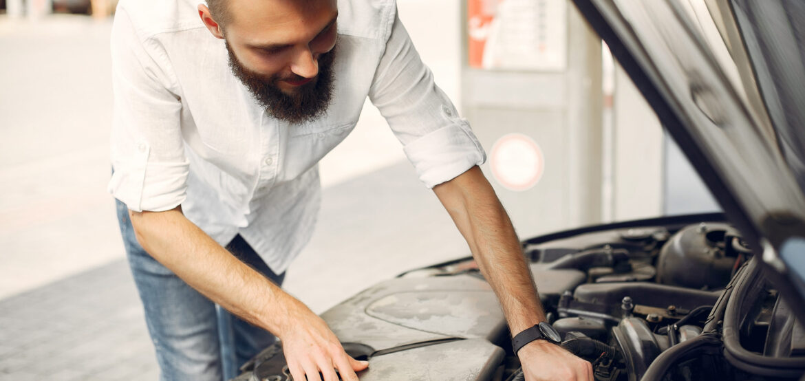 handsome man checks the engine in his car 2022 02 02 05 09 40 utc handsome man checks the engine in his car 2022 02 02 05 09 40 utc