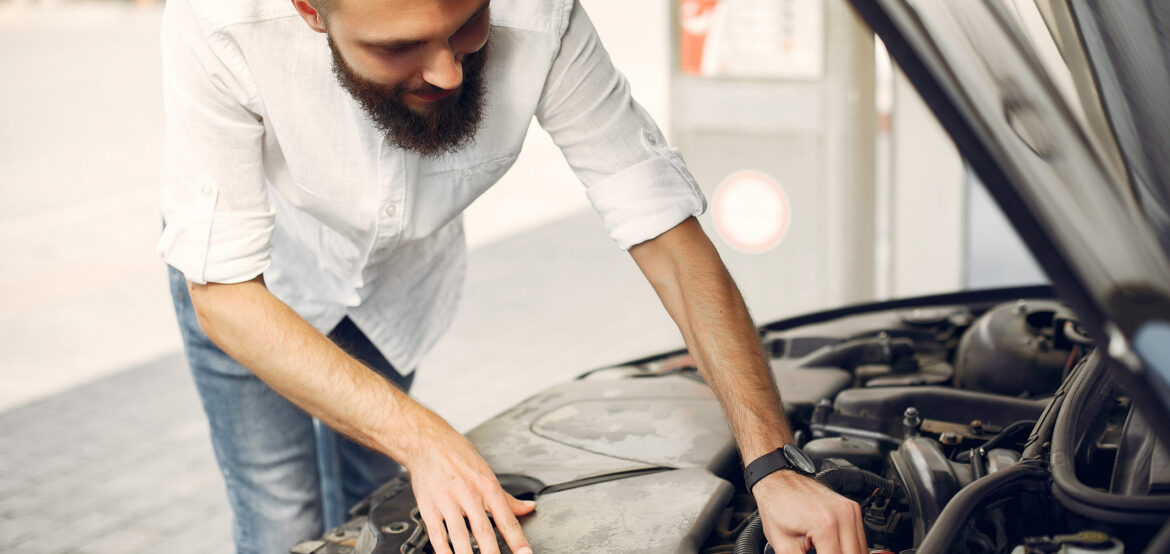 handsome man checks the engine in his car 2022 02 02 05 09 40 utc handsome man checks the engine in his car 2022 02 02 05 09 40 utc